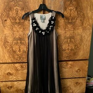 Stylish Sleeveless Dress with Floral Neckline